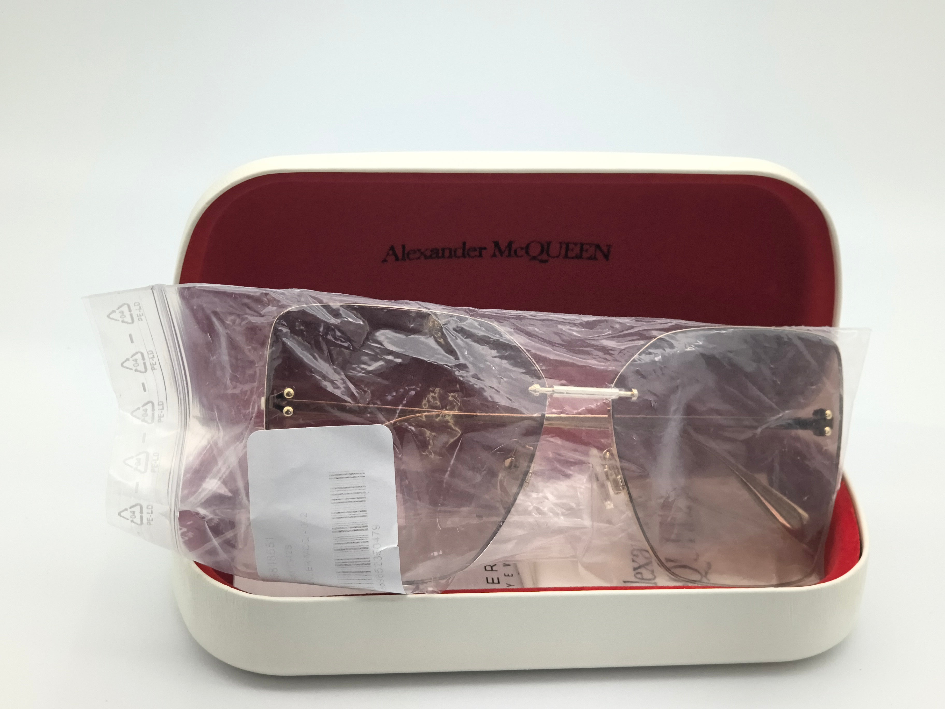 Okulary przeciwsłoneczne Alexander McQUEEN AM0342S  002 zarysowane